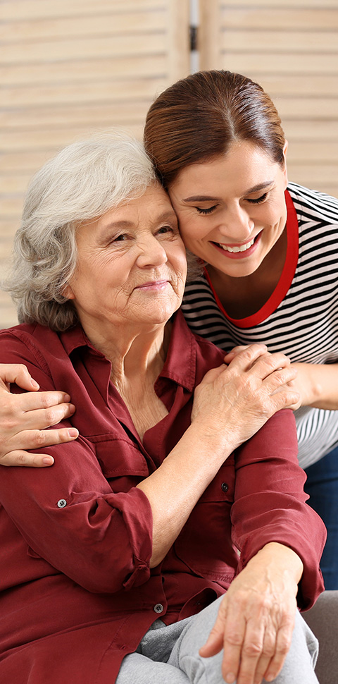 young woman embracing elderly woman in a caring moment showcasing love and support in a family setting 5 essential bonds