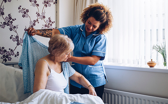 nurse assisting senior woman with care at home environment showing comforting care and support for 15 seconds